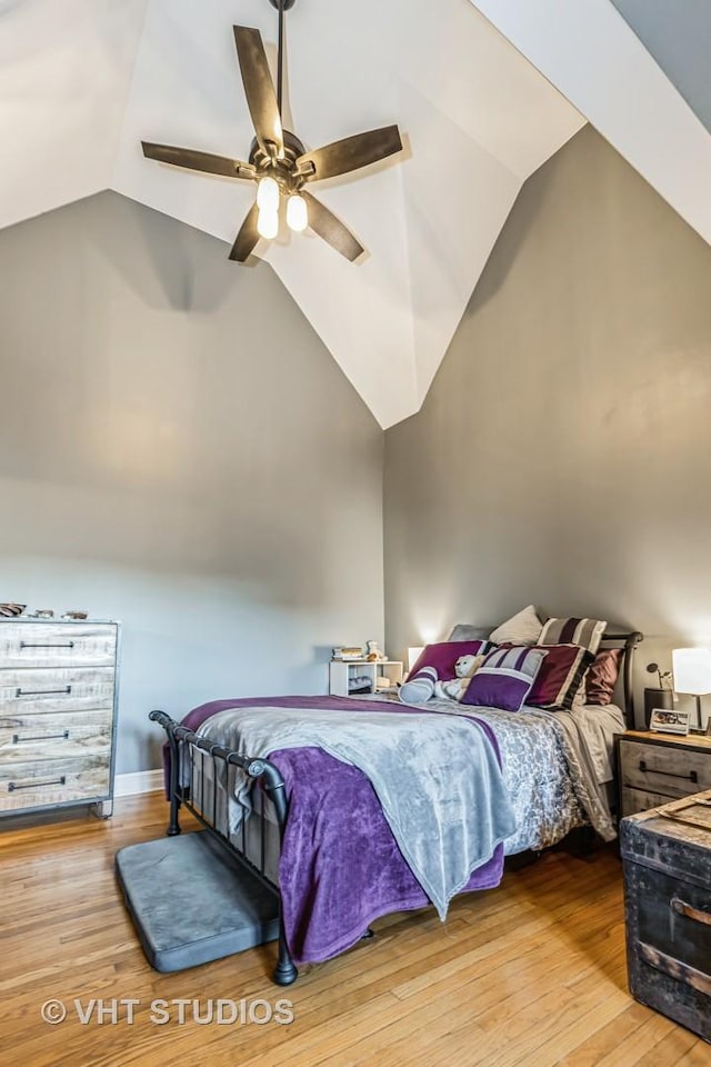 bedroom featuring vaulted ceiling, ceiling fan, and hardwood / wood-style floors