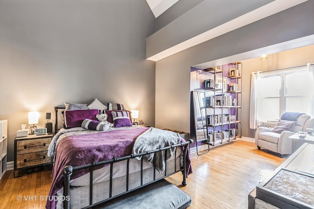 bedroom with hardwood / wood-style floors