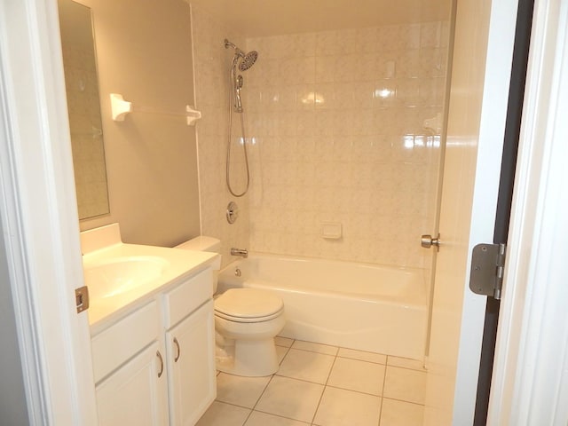 full bathroom featuring toilet, vanity, tiled shower / bath combo, and tile patterned floors