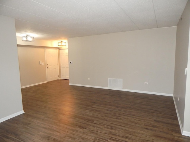 empty room featuring dark hardwood / wood-style floors