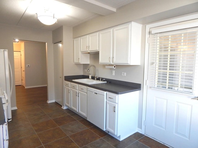 kitchen featuring sink, white cabinetry, dishwasher, and refrigerator