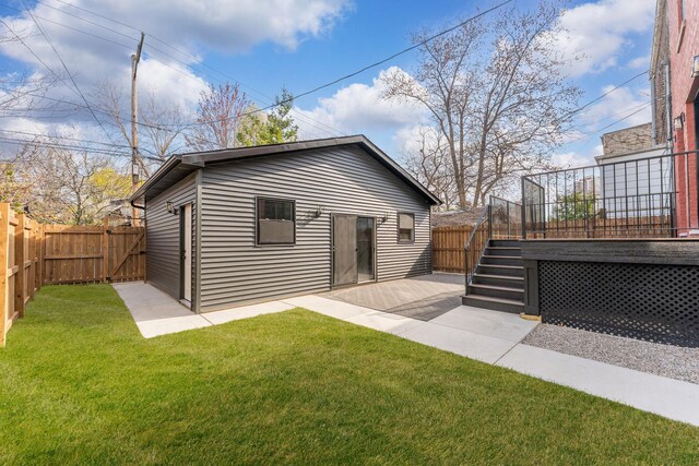 1254 W Norwood St, Chicago, IL 60660 - rear view of property featuring a fenced backyard, a patio area, a lawn, stairs, and a deck