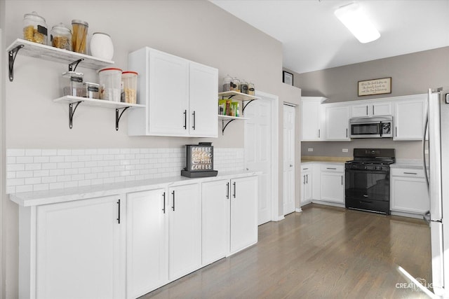 kitchen featuring stainless steel appliances, dark hardwood / wood-style floors, and white cabinets