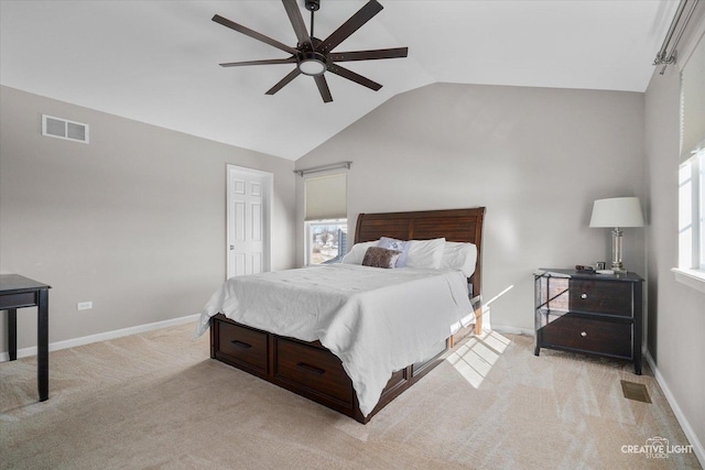 carpeted bedroom with lofted ceiling and ceiling fan