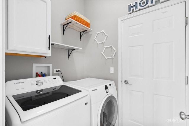 laundry area with cabinets and independent washer and dryer