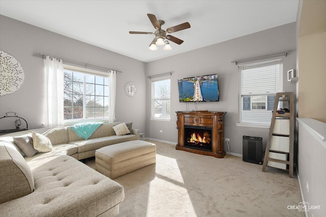 living room with light carpet and ceiling fan