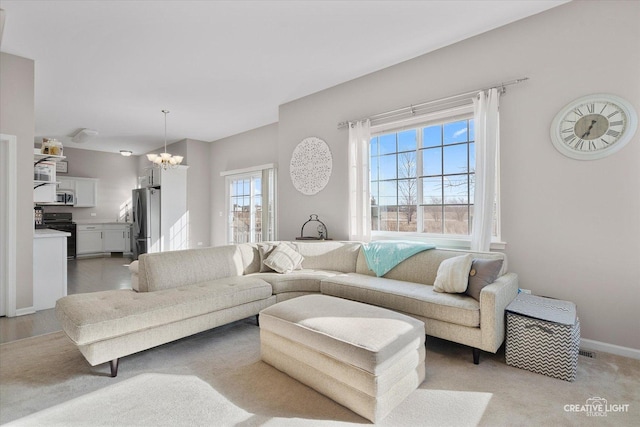 living room with an inviting chandelier