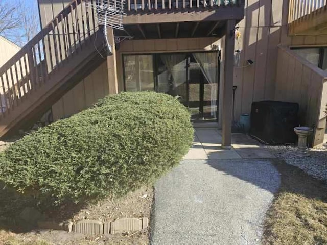 doorway to property with a patio area