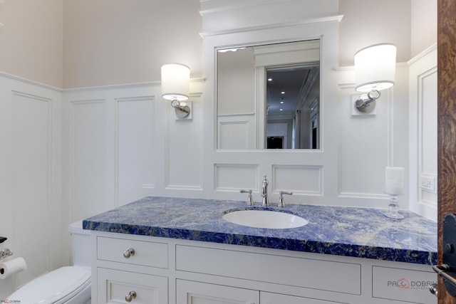 bathroom with vanity and toilet