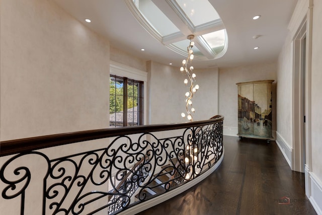 corridor featuring coffered ceiling and dark wood-type flooring