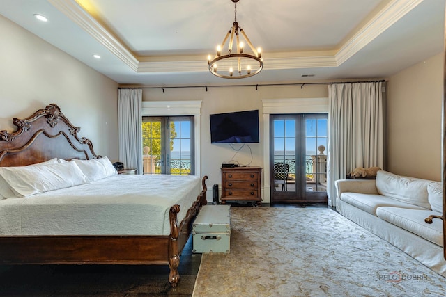 carpeted bedroom featuring access to exterior, ornamental molding, french doors, and a raised ceiling