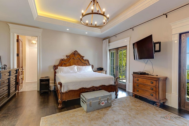 bedroom with ornamental molding, access to outside, a notable chandelier, a raised ceiling, and dark wood-type flooring