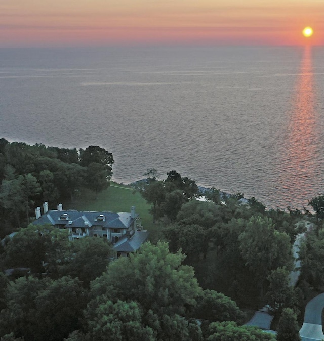 aerial view at dusk with a water view