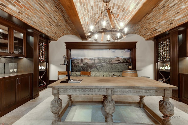 wine cellar with brick ceiling and lofted ceiling