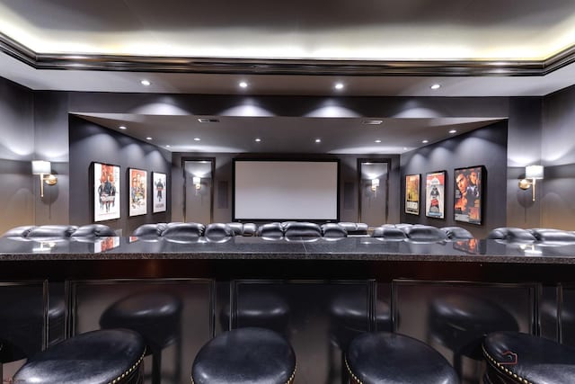 home theater room featuring bar area