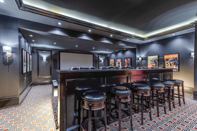 bar with carpet flooring and a tray ceiling