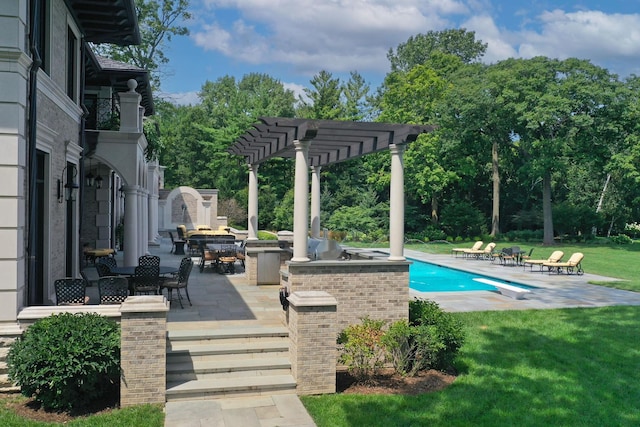 view of swimming pool featuring a diving board, a pergola, a bar, exterior kitchen, and a patio