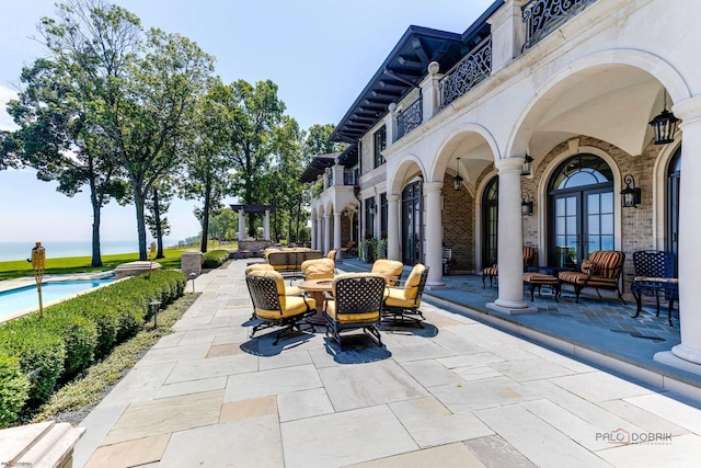 view of patio / terrace featuring a water view