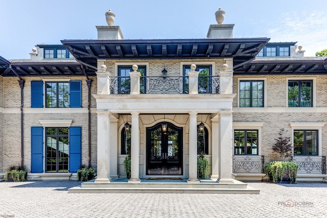 doorway to property featuring french doors and a balcony