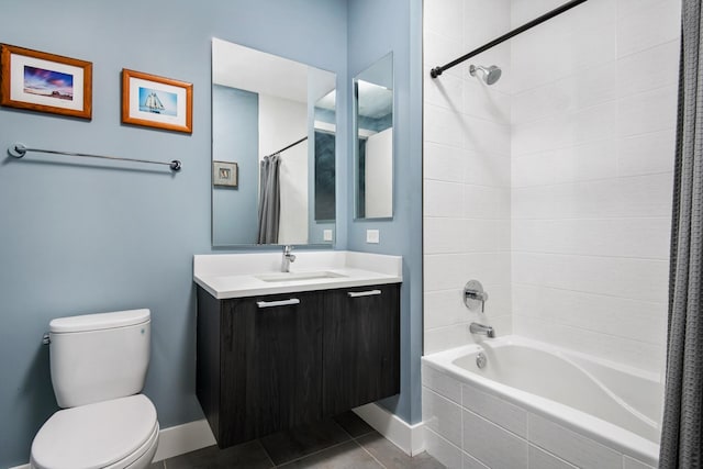 full bathroom featuring toilet, vanity, tile patterned flooring, and shower / bath combo with shower curtain