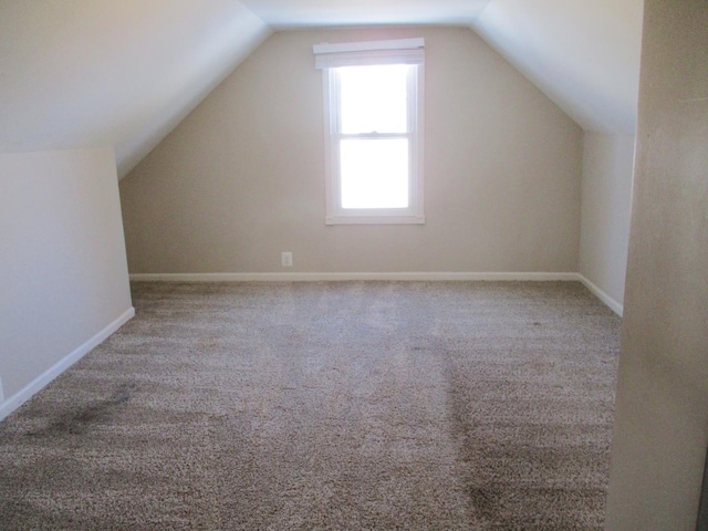 bonus room featuring carpet and lofted ceiling