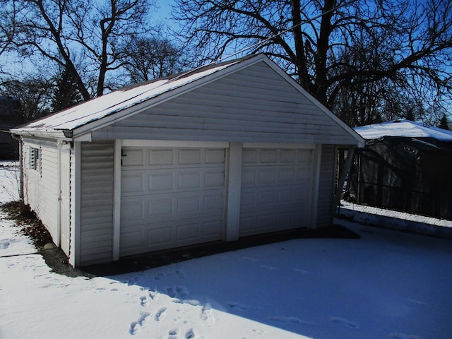 view of snow covered garage