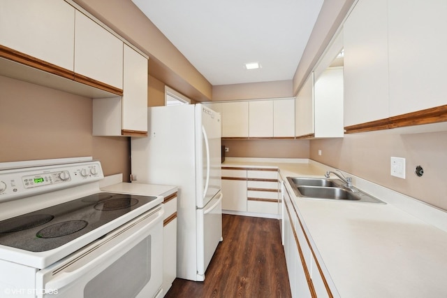 kitchen featuring electric stove, sink, dark hardwood / wood-style floors, and white cabinets