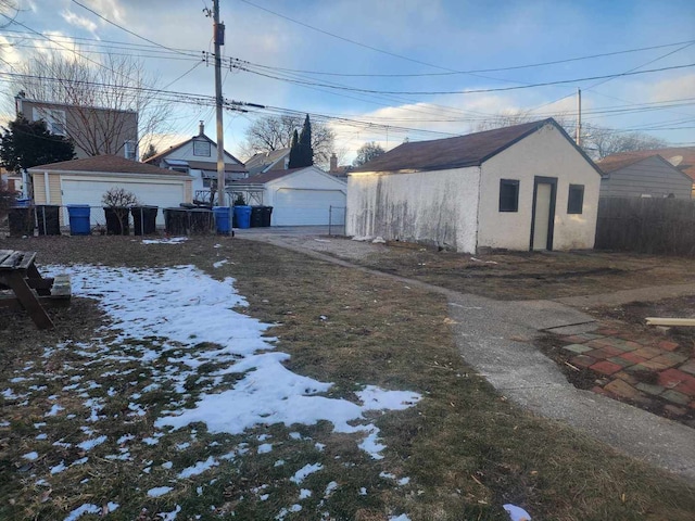 exterior space with an outbuilding and a garage