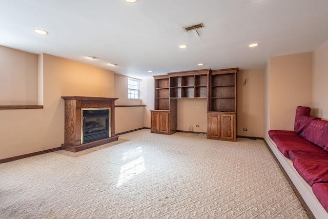 unfurnished living room with light colored carpet