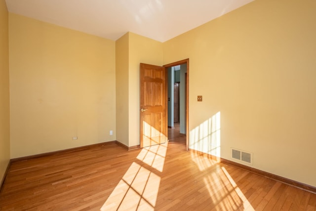 spare room featuring hardwood / wood-style flooring