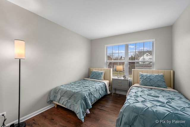 bedroom with dark wood-type flooring