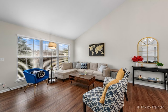 living room with high vaulted ceiling and dark wood-type flooring