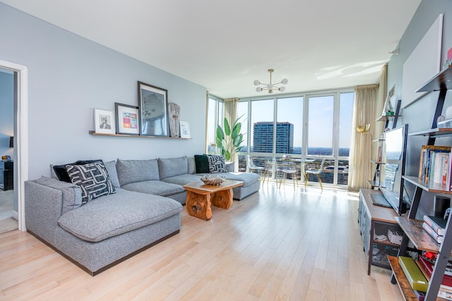 living room featuring light hardwood / wood-style floors and expansive windows