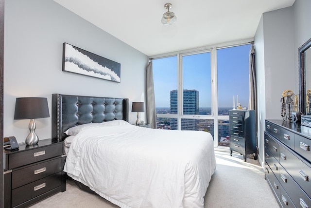 carpeted bedroom featuring expansive windows