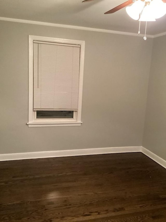 unfurnished room with ornamental molding, ceiling fan, and dark hardwood / wood-style flooring