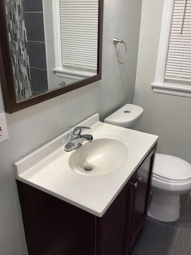 bathroom featuring vanity and toilet