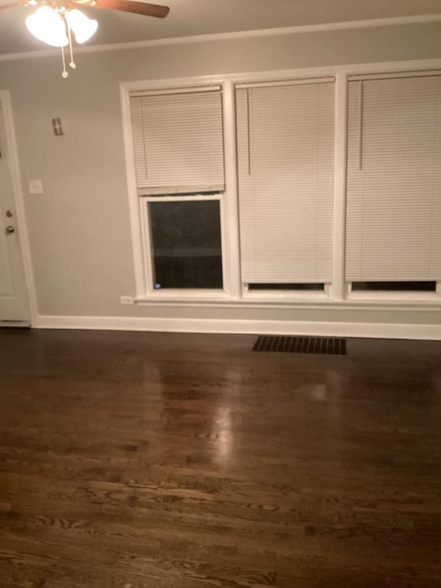 interior space with dark hardwood / wood-style floors and ceiling fan