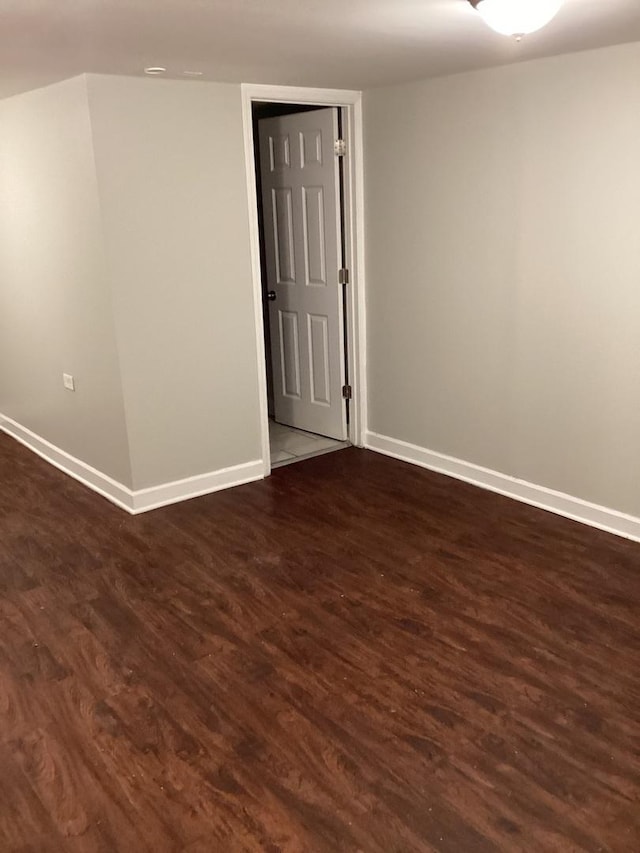 unfurnished room featuring dark hardwood / wood-style floors