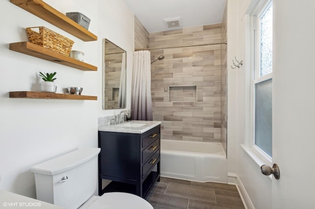 full bathroom featuring toilet, shower / bathtub combination with curtain, visible vents, and vanity