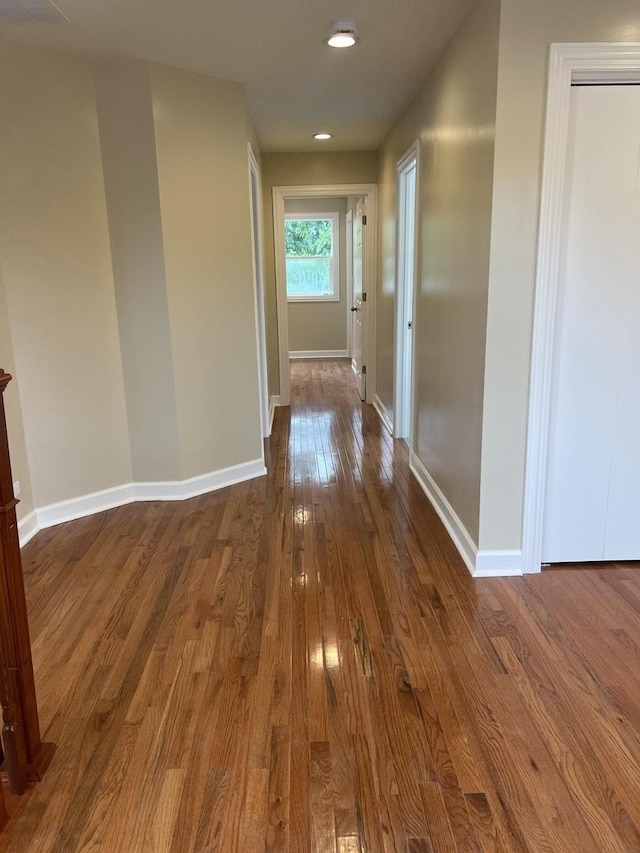 hallway featuring dark hardwood / wood-style floors