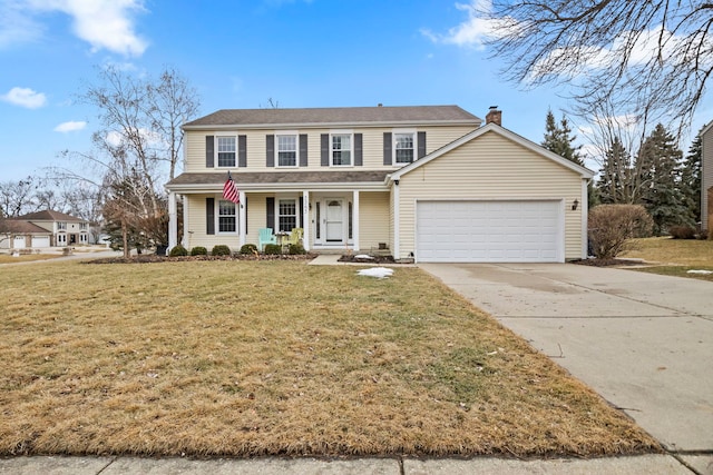 traditional home featuring a chimney, concrete driveway, covered porch, a front yard, and a garage