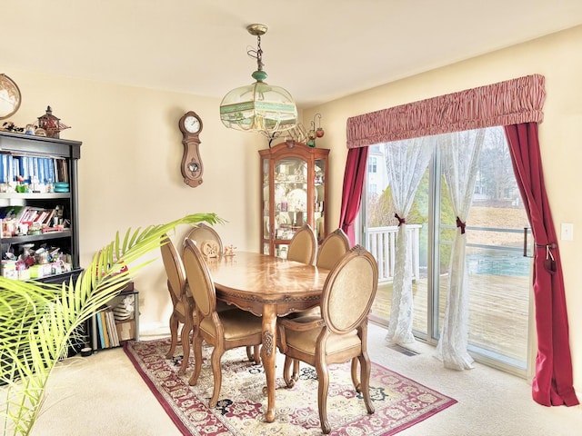 dining area with light carpet