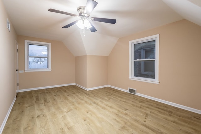 bonus room with ceiling fan, light hardwood / wood-style flooring, and lofted ceiling