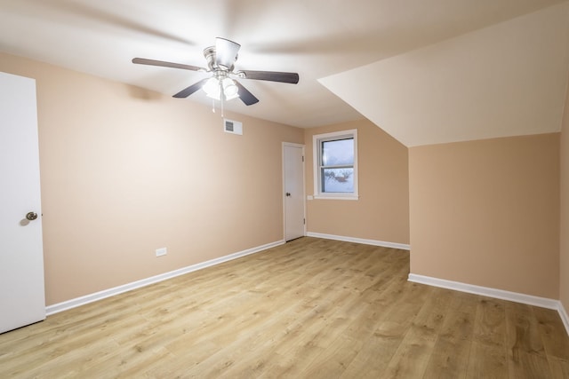 bonus room featuring ceiling fan, light hardwood / wood-style flooring, and lofted ceiling