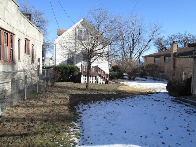 view of yard layered in snow