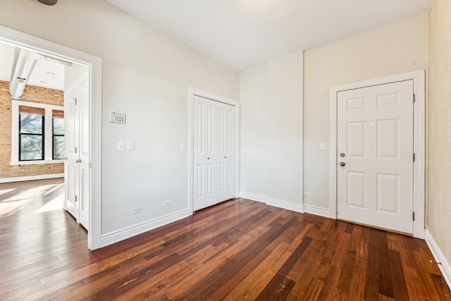 empty room featuring dark wood-type flooring