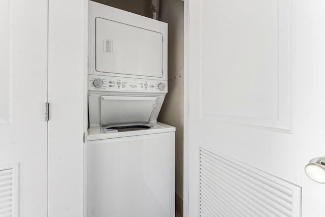 laundry room featuring stacked washer and dryer