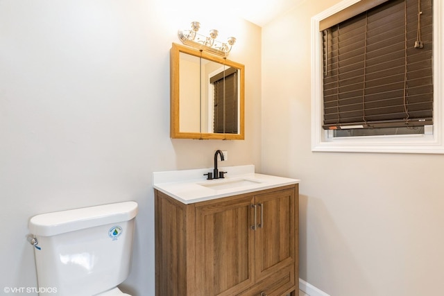 bathroom with toilet and vanity