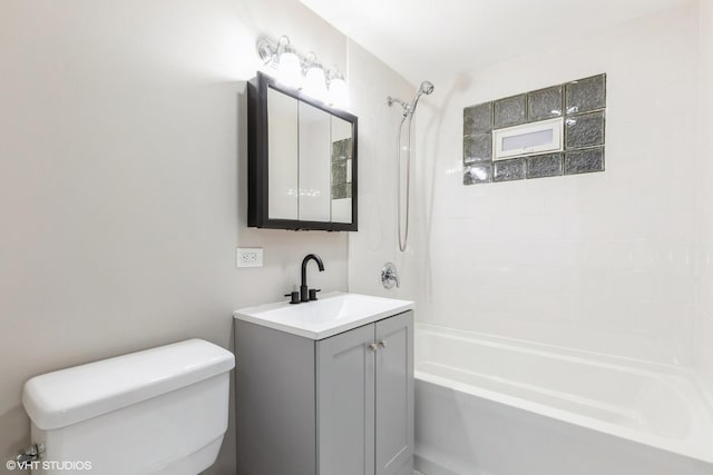 full bathroom featuring vanity,  shower combination, and toilet