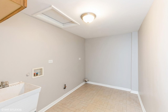 laundry area featuring sink, hookup for a washing machine, and hookup for a gas dryer